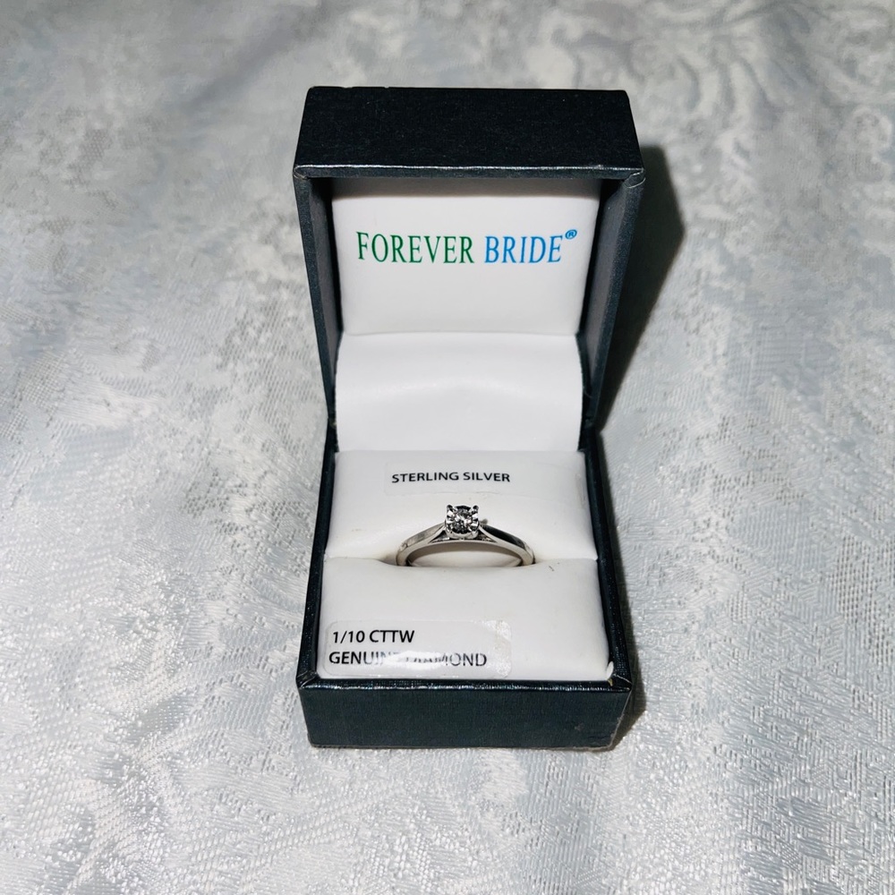 Sterling silver ring 1/10 cttw